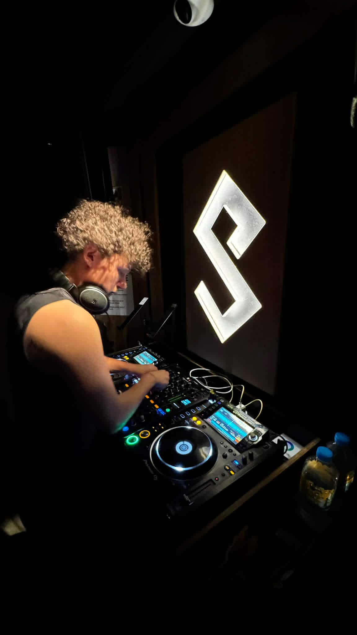 DJ KOZZ focused over Pioneer CDJ decks